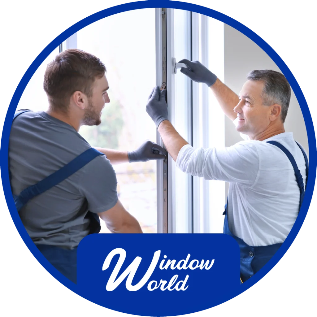 two window technicians working together to install a window with the window world logo at the bottom