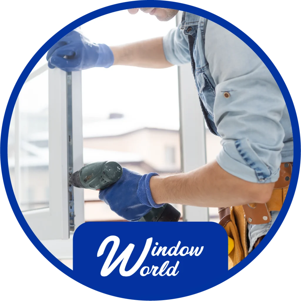 window installation technician installing and cleaning a window with the window world logo at the botton